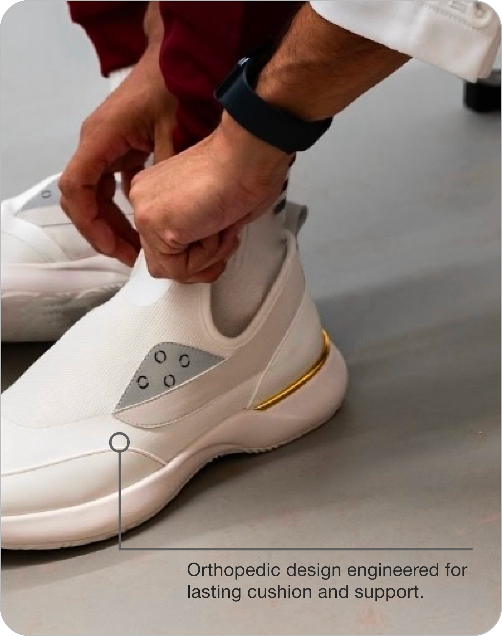A person's hands lacing up a white shoe with water-resistant mesh.